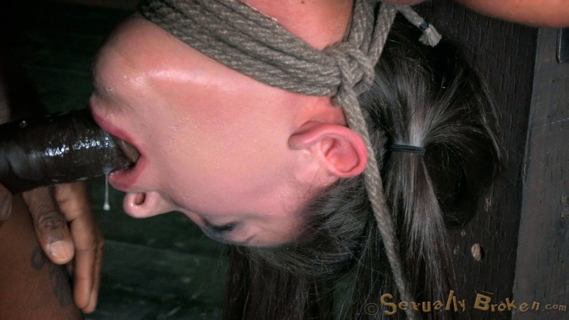 Lass hangs upside down and submissive sucks her master