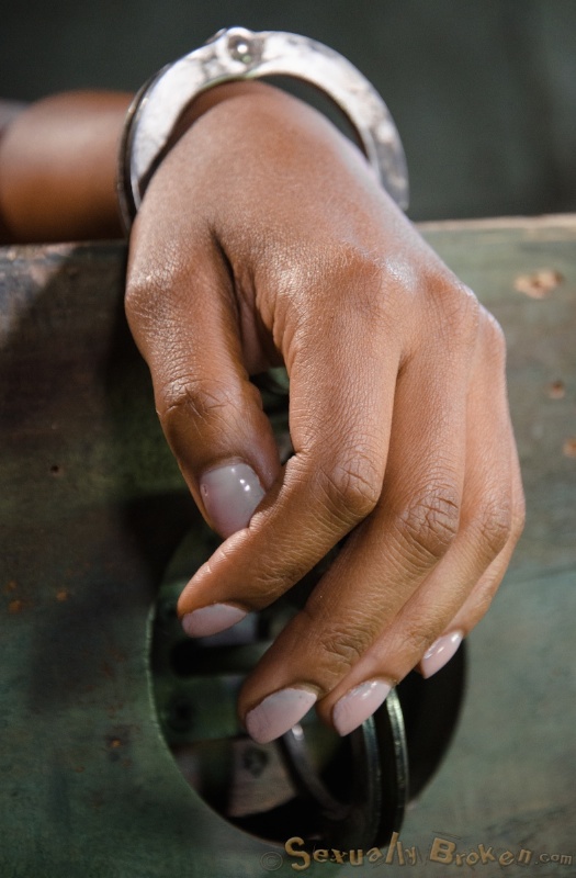 Cuffed Asian doll submissively sucks a white dick