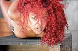 Foxy redhead victim gives an interracial blowjob