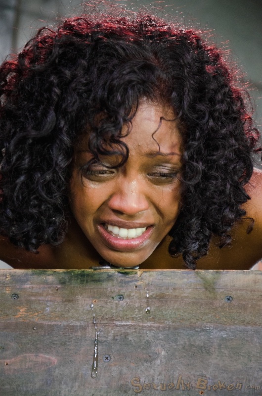 Cuffed Asian doll submissively sucks a white dick