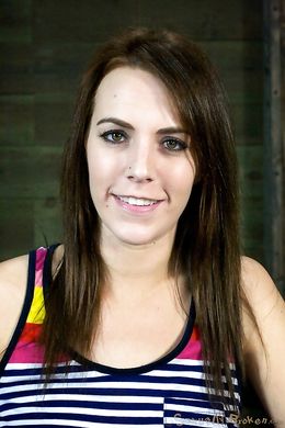 Restrained redhead sitting on a sybian and getting her throat fucked